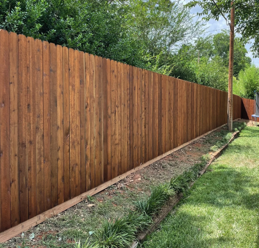 Stained dog-ear privacy fence